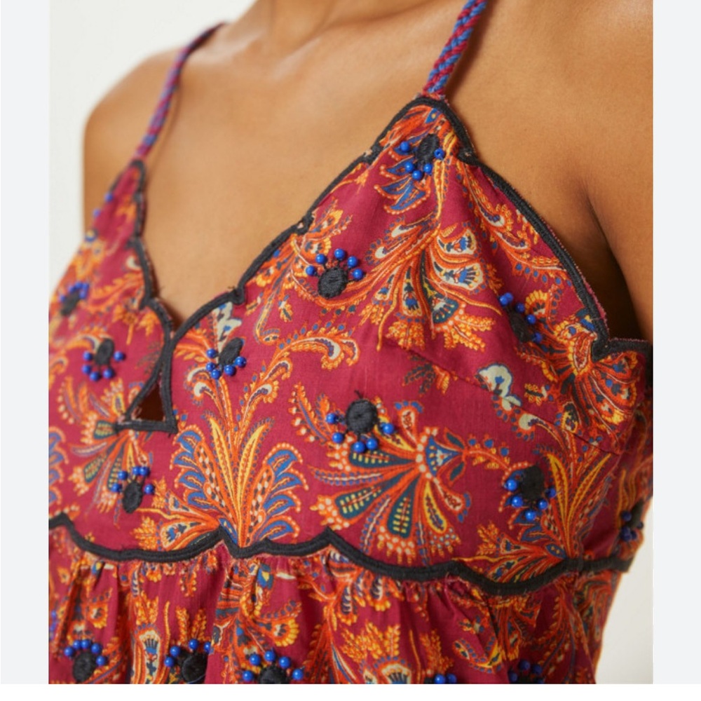 Embroidered cami. colorful & very cute on. The pictures don’t do this justice.